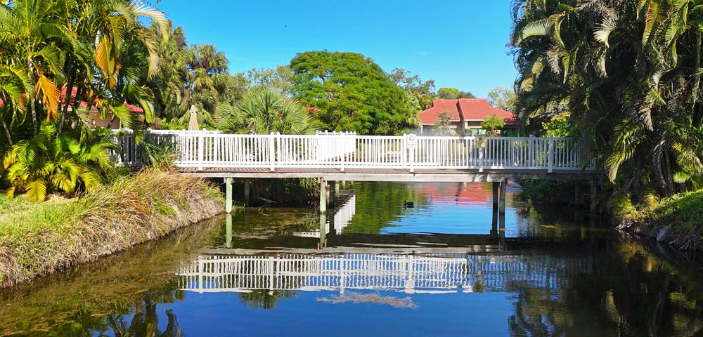 Bridge over Carriage Lake leading to pool