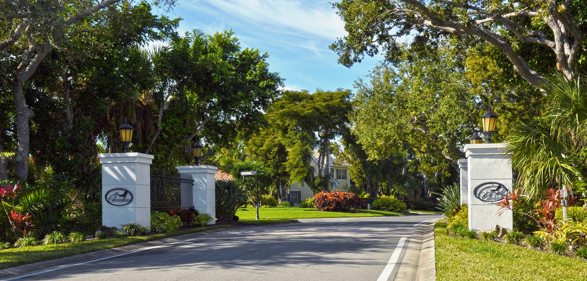 Street view of Cloisters neighborhood entry point with signage