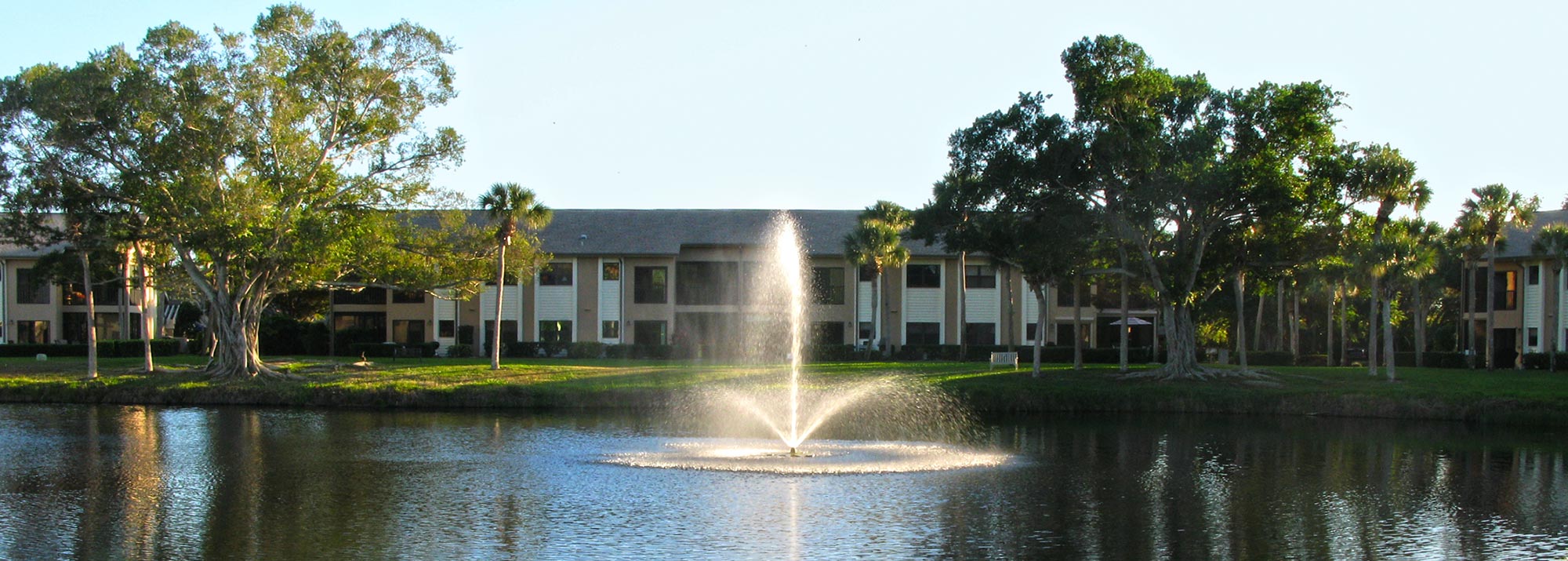 Backside view of Coach Houses from across Heron Lake